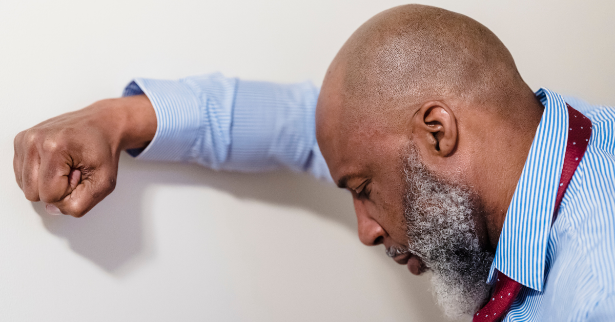 man is depressed with his head down