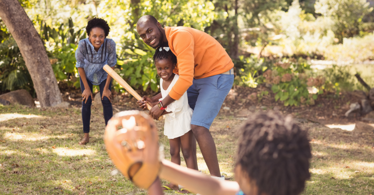 family playing baseball photo