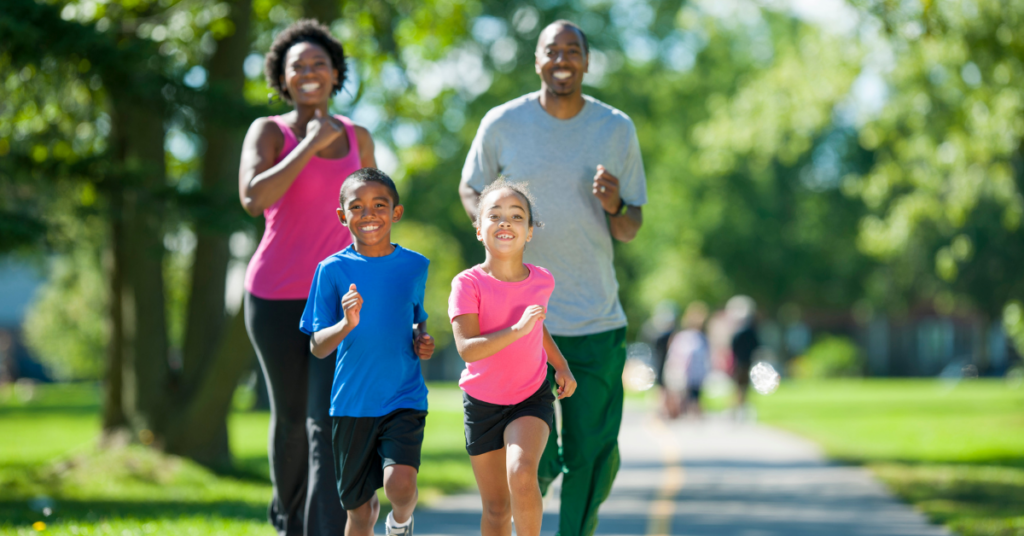 a family of four enjoying a jog