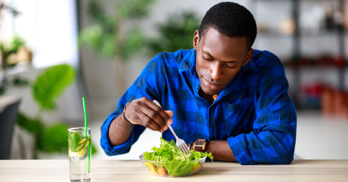 black nutrition, man eats salad